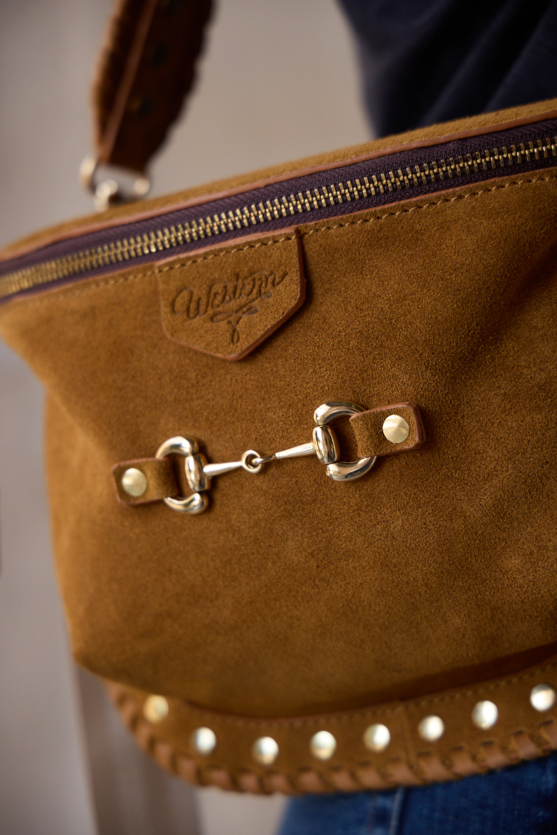 carmel suede bum bag with gold studs and snaffle bit on front