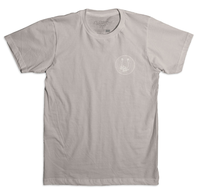 A grey t-shirt with a horseshoe graphic on the front