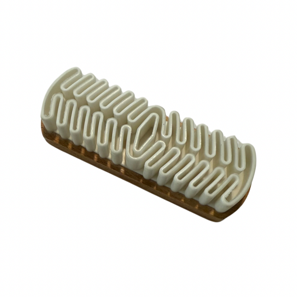 A varnished wooden crepe brush