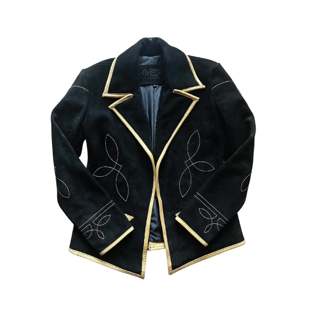 a black suede blazer with tan leather details