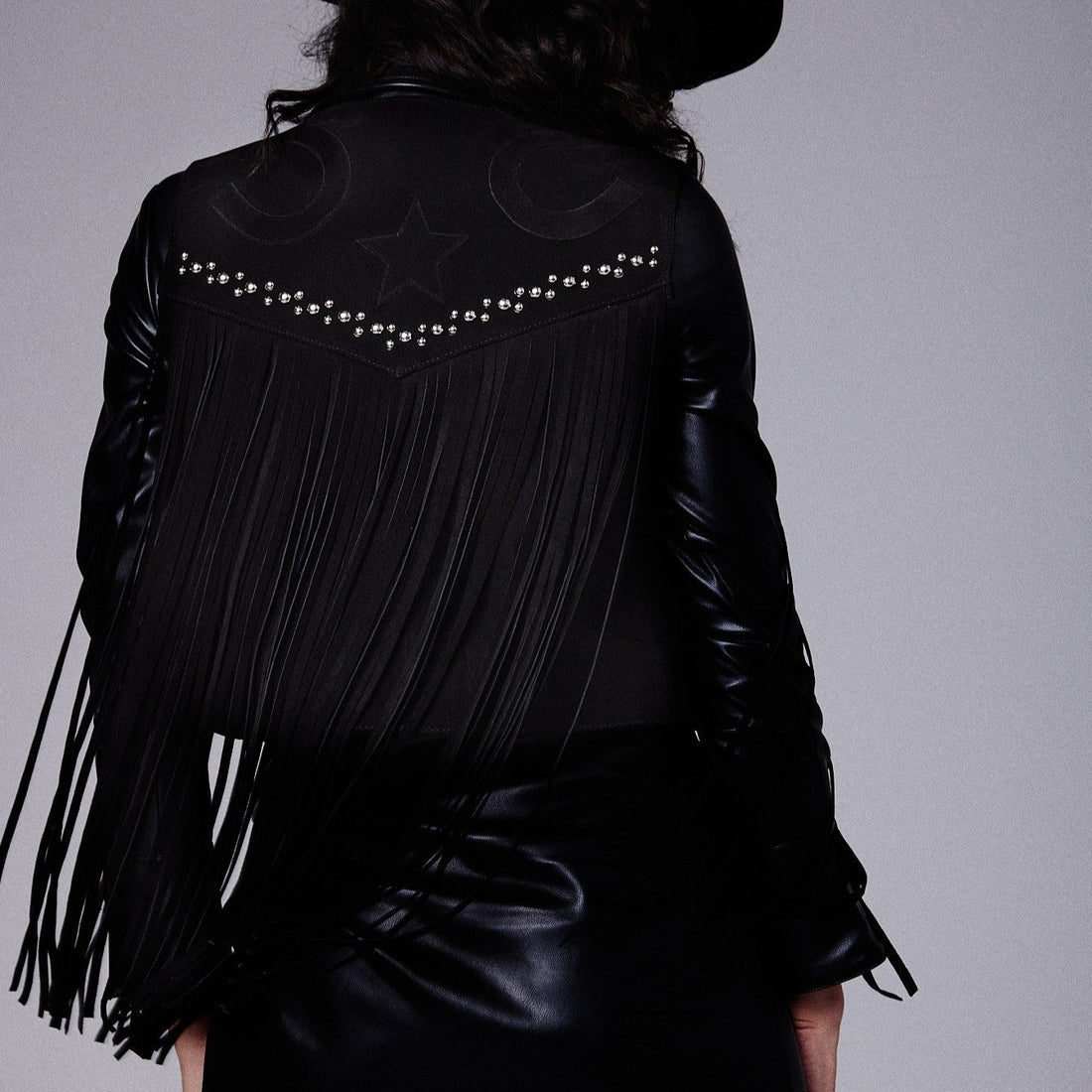 black studded fringe vest with horseshoe applique detail on  on the back