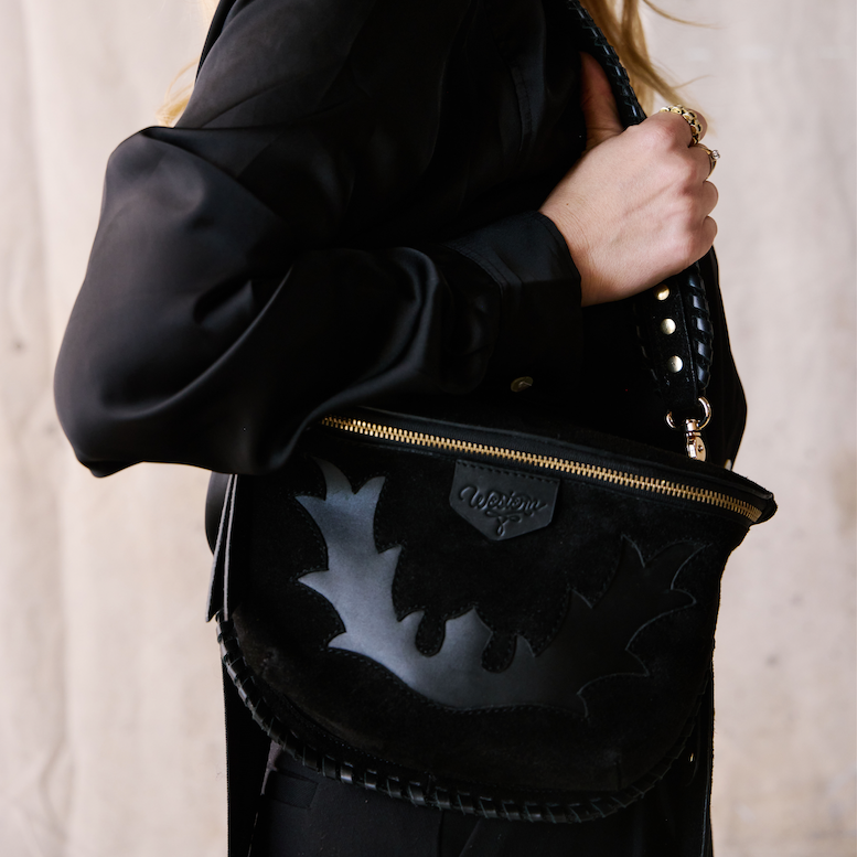 black suede bum bag with leather design and gold hardware